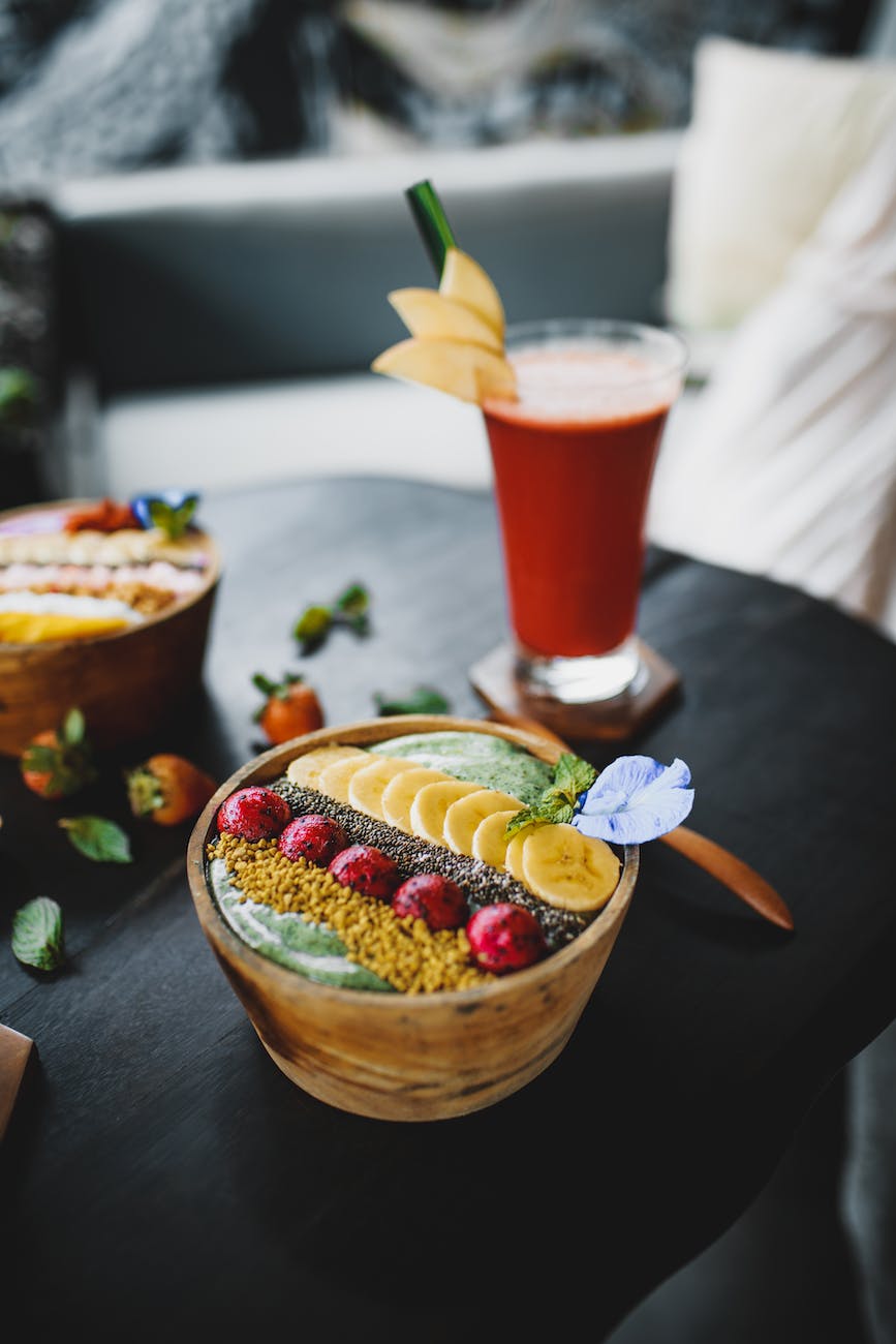 delicious dessert with fruits and juice on table