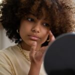 woman looking at a mirror