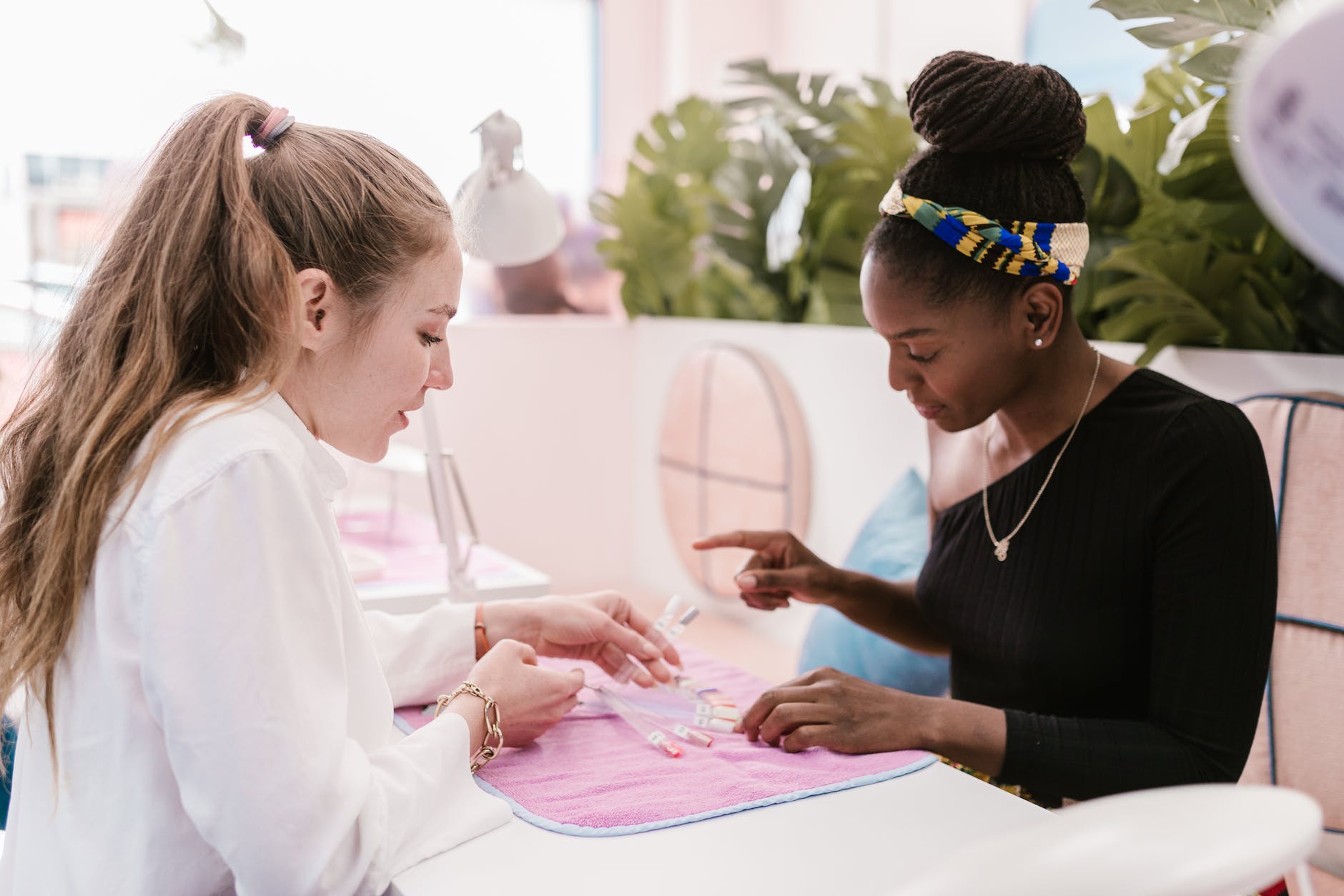 a client choosing a nail color palette