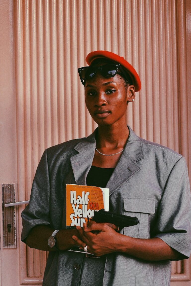 beautiful woman with book and gun