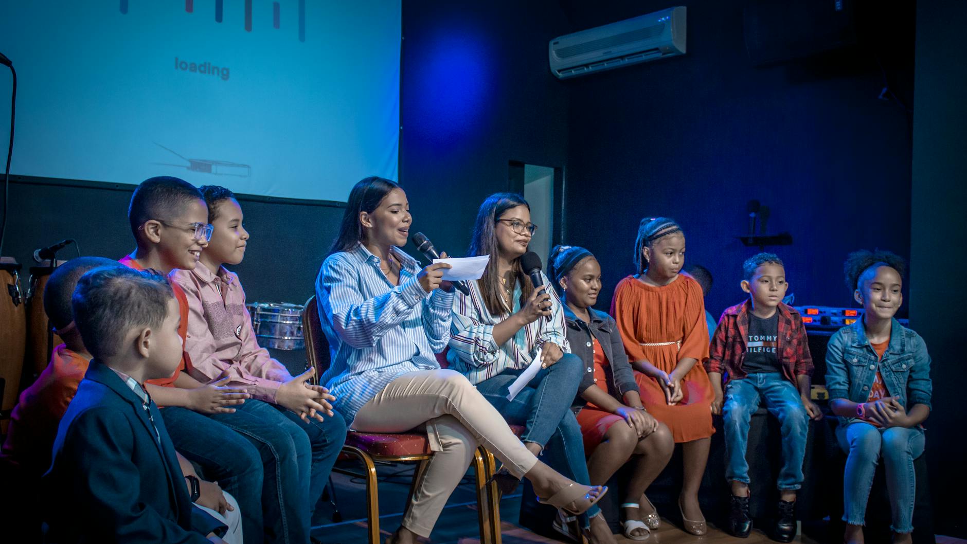 women sitting with children