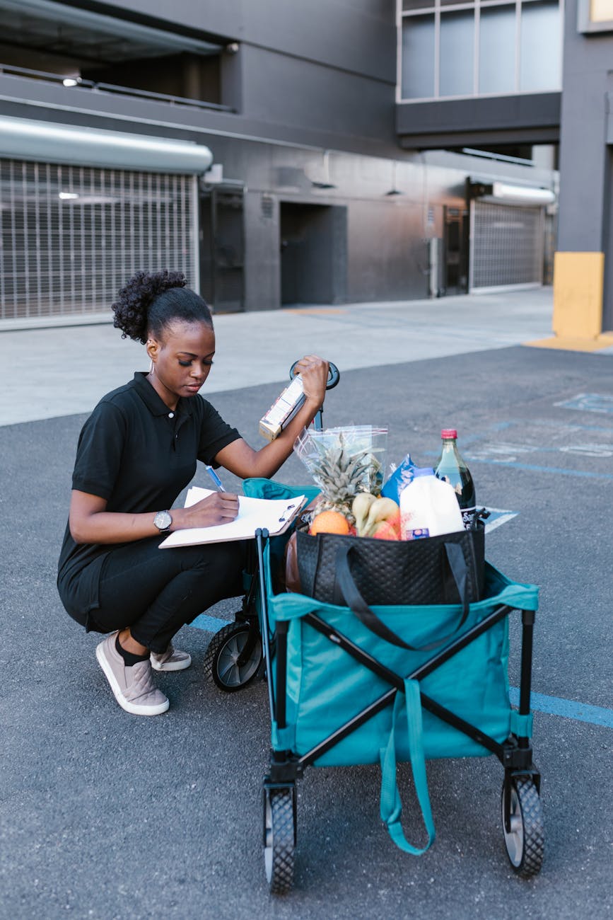 a deliverywoman checking her deliveries